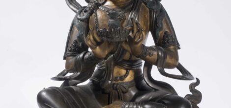 Rare statue en bronze de patine brune partiellement doré représentant le Bouddha Locanâ